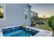 Cozy hot tub on the home's exterior, with a view of the beautifully landscaped backyard at 1543 Eastbrook Dr, Sarasota, FL 34231