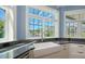 Farmhouse sink under a large window offering bright light and views of the landscape at 1543 Eastbrook Dr, Sarasota, FL 34231