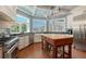 Bright kitchen featuring natural light, an island, stainless steel appliances, and plenty of cabinet space at 1543 Eastbrook Dr, Sarasota, FL 34231