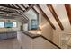 Spacious living room featuring high ceilings, exposed wooden beams, hardwood floors, and lots of natural light at 1543 Eastbrook Dr, Sarasota, FL 34231