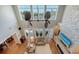 Open concept living room with soaring ceilings, hardwood floors, and a beautiful stone fireplace at 1543 Eastbrook Dr, Sarasota, FL 34231