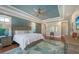 Spacious main bedroom with tray ceiling, accent wall, and hardwood flooring at 1543 Eastbrook Dr, Sarasota, FL 34231