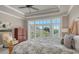 Spacious bedroom with large windows providing natural light, a decorative bed, and ample space at 1543 Eastbrook Dr, Sarasota, FL 34231
