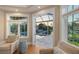 Sitting area with exterior views to canal and pool at 1543 Eastbrook Dr, Sarasota, FL 34231