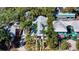 Aerial view of the home showcasing lush landscaping and unique architectural design at 1631 Loma Linda St, Sarasota, FL 34239
