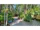 Inviting backyard with lush greenery, patio and comfortable seating at 1631 Loma Linda St, Sarasota, FL 34239