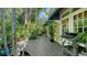 Deck with a grill, lush landscaping, and seating, perfect for outdoor living at 1631 Loma Linda St, Sarasota, FL 34239
