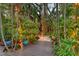 Relaxing backyard space with lush landscaping and elegant outdoor lighting at 1631 Loma Linda St, Sarasota, FL 34239