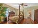 Spacious primary bedroom with a beautiful four-poster bed and traditional furnishings at 1631 Loma Linda St, Sarasota, FL 34239