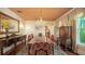 Elegant dining room with a chandelier, antique furnishings, and a formal dining table setting at 1631 Loma Linda St, Sarasota, FL 34239