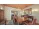Elegant dining room featuring a chandelier, antique furniture, and formal dining set, perfect for entertaining at 1631 Loma Linda St, Sarasota, FL 34239