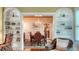 Dining room viewed through built-in shelving featuring chandelier and table at 1631 Loma Linda St, Sarasota, FL 34239