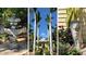 A home featuring a water feature, palm trees, flowering plants, and a lion statue at 1631 Loma Linda St, Sarasota, FL 34239