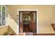 Elegant front door with glass panels and a transom window, welcoming you inside the home at 1631 Loma Linda St, Sarasota, FL 34239