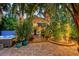 Charming home with brick patio, manicured tropical landscaping and soothing hot tub at 1631 Loma Linda St, Sarasota, FL 34239