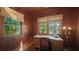 Inviting home office with wood paneling, natural light, and a traditional desk setup at 1631 Loma Linda St, Sarasota, FL 34239