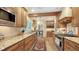 Well-appointed kitchen with granite countertops, custom cabinetry, and modern stainless steel appliances at 1631 Loma Linda St, Sarasota, FL 34239