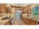 Spacious kitchen featuring custom cabinets, granite countertops, and modern stainless steel appliances at 1631 Loma Linda St, Sarasota, FL 34239