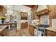 Charming kitchen with wooden cabinets, granite countertops, and stainless steel range at 1631 Loma Linda St, Sarasota, FL 34239