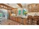 Traditional kitchen with wood cabinets, granite counters and charming accents for a warm and inviting cooking space at 1631 Loma Linda St, Sarasota, FL 34239