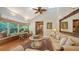 Open concept living room features a breakfast nook and hardwood floors, connecting to the kitchen and providing natural light at 1631 Loma Linda St, Sarasota, FL 34239