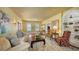 Comfortable living room with hardwood floors, a decorative fireplace, and a large window at 1631 Loma Linda St, Sarasota, FL 34239