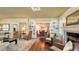 Open-concept living room with hardwood floors, built-in bookshelves, and inviting seating areas at 1631 Loma Linda St, Sarasota, FL 34239