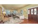 Bright living room featuring a fireplace, hardwood floors, and plenty of seating at 1631 Loma Linda St, Sarasota, FL 34239