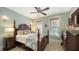 The main bedroom features a king bed, natural light, wood furniture and a ceiling fan at 1631 Loma Linda St, Sarasota, FL 34239