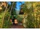 Cozy patio area with chairs, surrounded by lush tropical plants, creating a private retreat at 1631 Loma Linda St, Sarasota, FL 34239