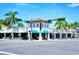 Upscale shopping center boasts blue awnings, restaurants, and coastal charm at 1631 Loma Linda St, Sarasota, FL 34239