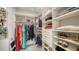 A well-organized walk-in closet offers ample storage with shelves and hanging rods for clothing and accessories at 1631 Loma Linda St, Sarasota, FL 34239