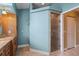 View of the bathroom with granite counters, a glass shower, and linen closet at 17368 Norseman Ave, Port Charlotte, FL 33948