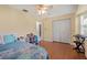 Bedroom with laminate flooring, a ceiling fan, and a closet at 17368 Norseman Ave, Port Charlotte, FL 33948