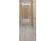 Hallway featuring light-colored wood-look floors and neutral wall paint at 17368 Norseman Ave, Port Charlotte, FL 33948