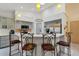 Bright kitchen with light countertops, stainless appliances, and cozy barstool seating at 17368 Norseman Ave, Port Charlotte, FL 33948