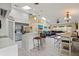 Open-concept living space features a kitchen, dining area, and living room at 17368 Norseman Ave, Port Charlotte, FL 33948