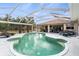 Inviting screened-in pool with lounge chairs and ample deck space for relaxation at 17368 Norseman Ave, Port Charlotte, FL 33948