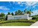 Avelina Wellen Park community entrance sign surrounded by beautiful landscaping against a blue sky at 18771 Toulon Ct, Venice, FL 34293