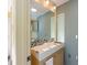 Bathroom featuring a modern square sink with modern faucets, and a built-in mirror cabinet at 207 82Nd St, Holmes Beach, FL 34217
