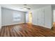 Bright bedroom with hardwood floors, ceiling fan, and lots of natural light at 2307 Homestead Cir, North Port, FL 34286