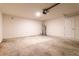 Spacious garage with concrete flooring, white walls, and an automatic door opener, ready for customization at 2307 Homestead Cir, North Port, FL 34286