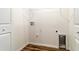 Well-lit laundry area with hookups and ample storage space at 2307 Homestead Cir, North Port, FL 34286