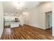 Spacious living area with wood-look floors seamlessly flows into the open kitchen at 2307 Homestead Cir, North Port, FL 34286