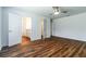 Spacious main bedroom with ceiling fan and ensuite bathroom at 3197 N Chamberlain Blvd, North Port, FL 34286