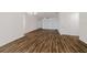 Spacious living room featuring hardwood floors, abundant natural light, and a modern ceiling fan at 3267 N Chamberlain Blvd, North Port, FL 34286