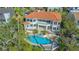 Stunning aerial view of estate featuring a private pool, lush landscaping, and exquisite architecture with a beautiful terracotta roof at 3491 Bayou Sound, Longboat Key, FL 34228