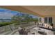An elegant waterfront balcony featuring comfortable seating and stunning scenic views and glass railing at 3491 Bayou Sound, Longboat Key, FL 34228