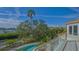 Balcony view of pool, boat dock, and water providing the ultimate outdoor living experience at 3491 Bayou Sound, Longboat Key, FL 34228