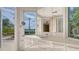 Bathroom vanity features ample counter space and drawers, framed by windows with an outdoor view at 3491 Bayou Sound, Longboat Key, FL 34228